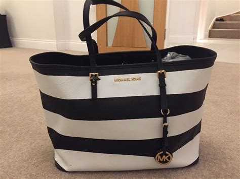 michael kors striped black and white bag|Michael Kors hand bag price.